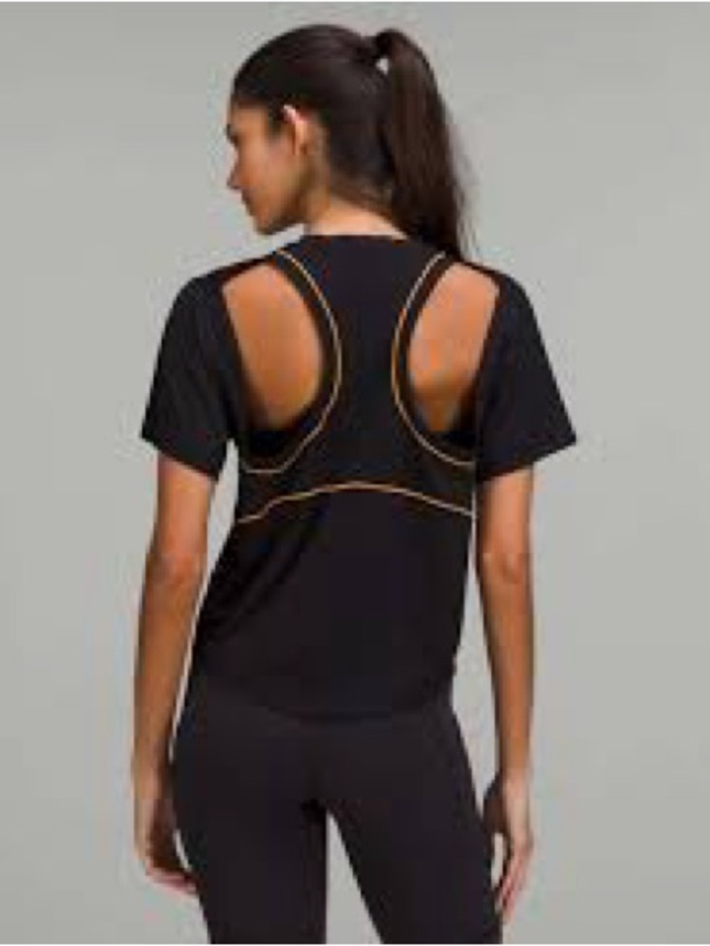 Lululemon Ventilated Open-Back Training T-Shirt in Black with Orange Soda trim